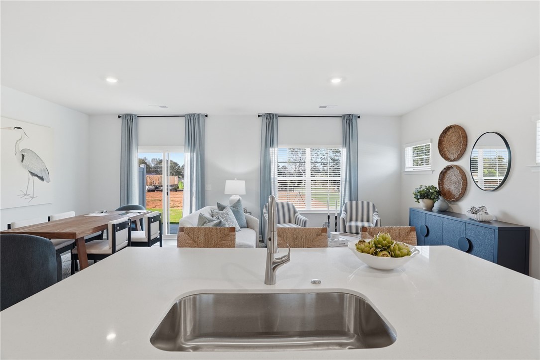 331 Lilac Loop Greenwood, SC 29646 - Photo 11 of 27 This bright, open concept living space features a spacious kitchen island and abundant natural light.