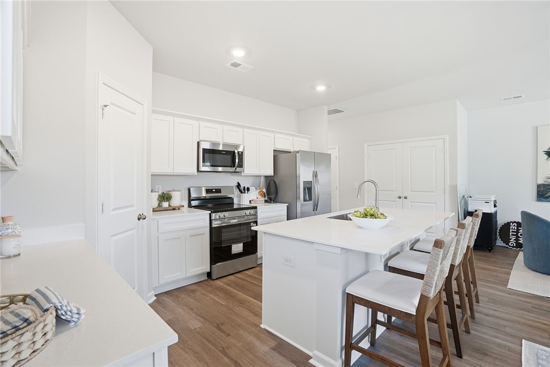 331 Lilac Loop Greenwood, SC 29646 - Photo 12 of 27 Bright, open-concept kitchen with a large island for casual dining and entertaining.