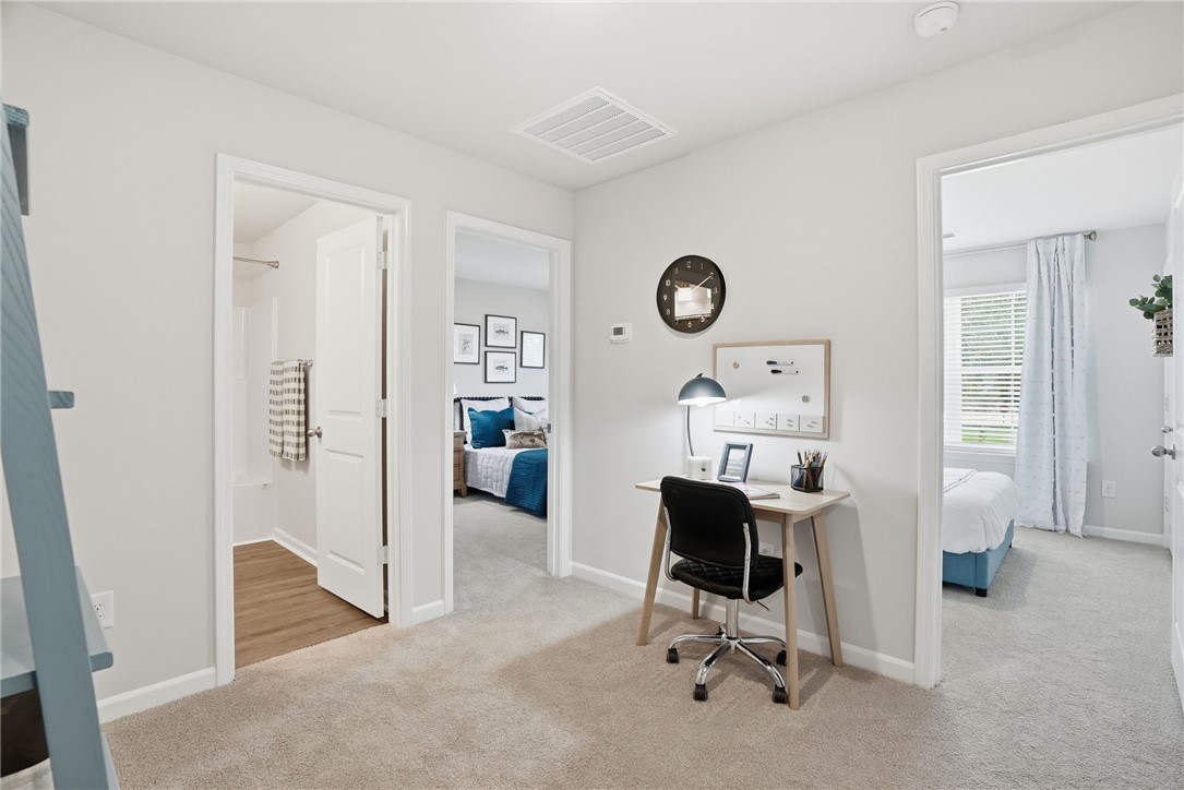 331 Lilac Loop Greenwood, SC 29646 - Photo 20 of 27 This versatile flex space connects to multiple rooms, offering adaptable living.