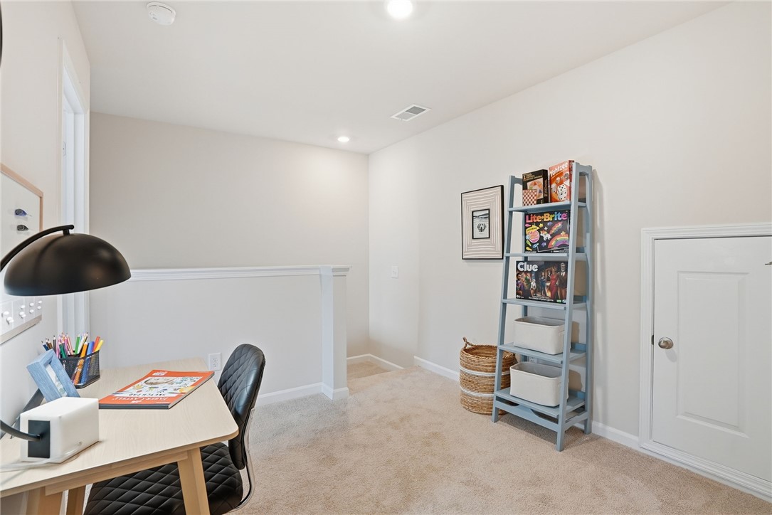 331 Lilac Loop Greenwood, SC 29646 - Photo 21 of 27 Bright and inviting loft area offers versatile space for work or play.
