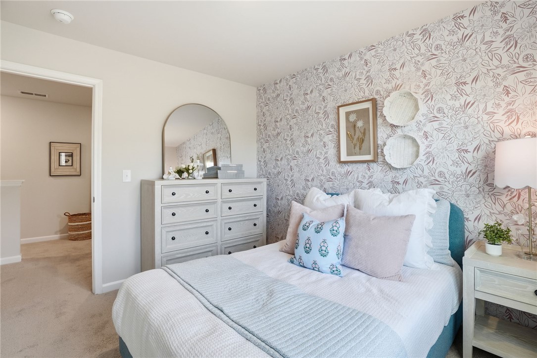 331 Lilac Loop Greenwood, SC 29646 - Photo 23 of 27 This cozy bedroom offers a tranquil retreat with charming details.