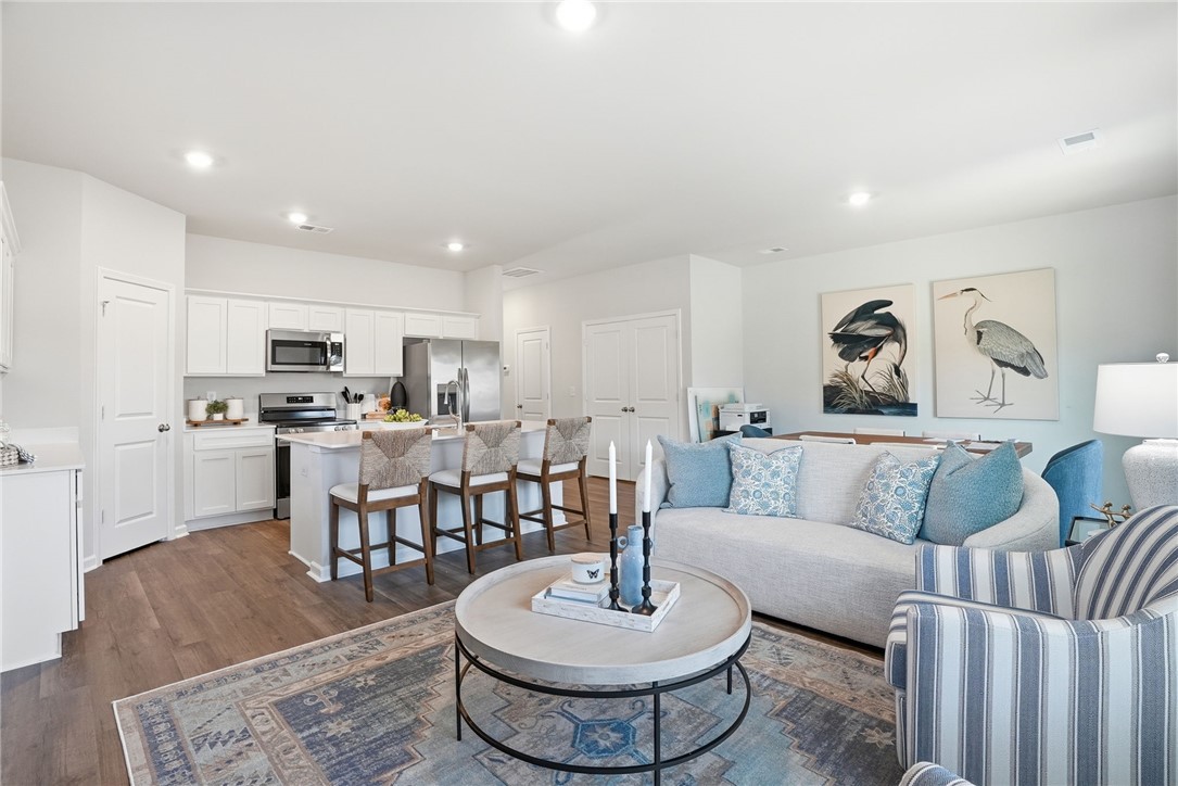 331 Lilac Loop Greenwood, SC 29646 - Photo 5 of 27 This bright and airy open-concept living space seamlessly connects the kitchen and living room.