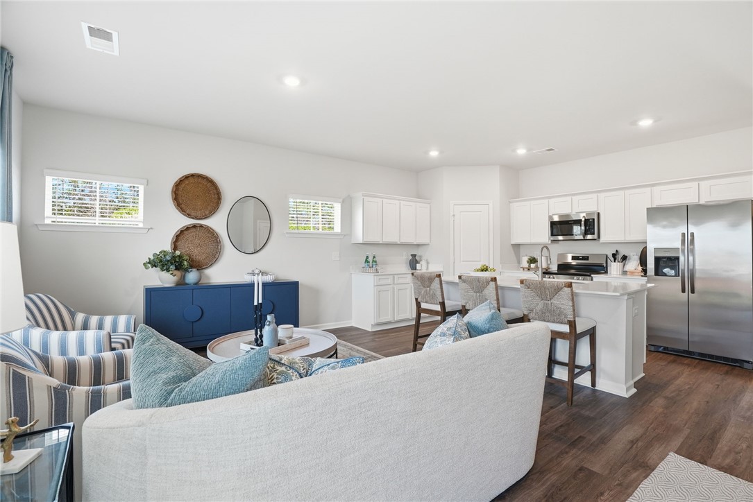 331 Lilac Loop Greenwood, SC 29646 - Photo 7 of 27 This inviting space seamlessly blends living and kitchen areas, perfect for daily life and entertaining.