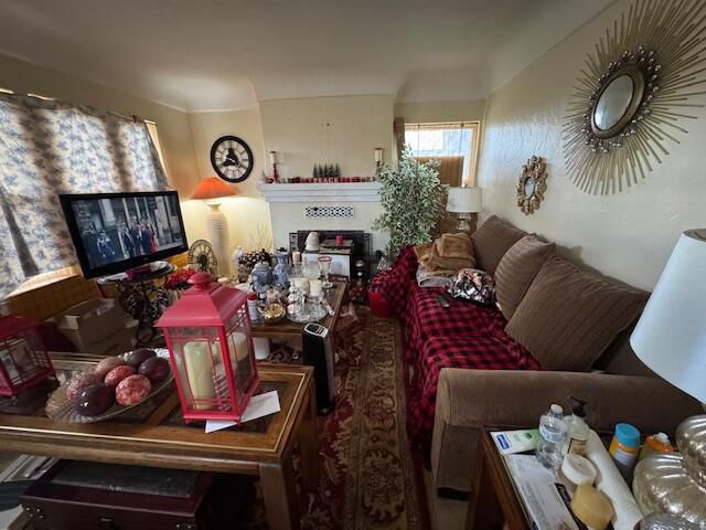 205 West Lancaster Boulevard Lancaster, CA 93534 - Photo 4 of 12 a living room with furniture and a large window