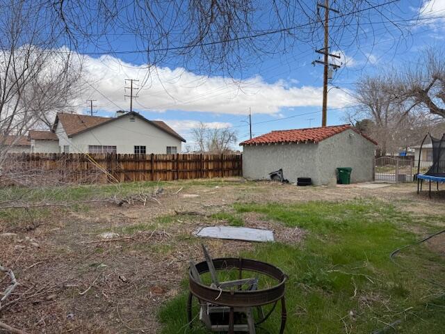 205 West Lancaster Boulevard Lancaster, CA 93534 - Photo 10 of 12 a backyard of a house with table and chairs