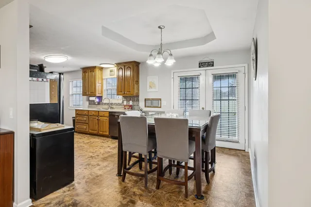 a view of a dining room with furniture window and outside view