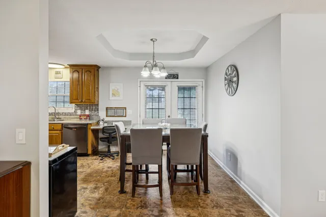a view of a dining room with furniture and window