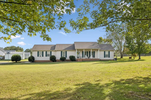 a front view of a house with swimming pool
