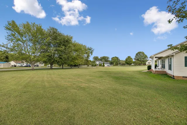 a view of a lake with a big yard