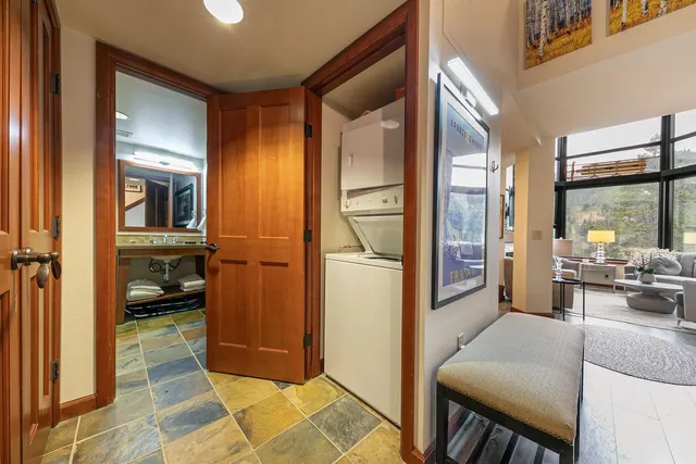 a view of a hallway with living room and furniture
