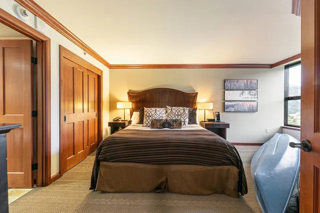 a bedroom with a bed and window