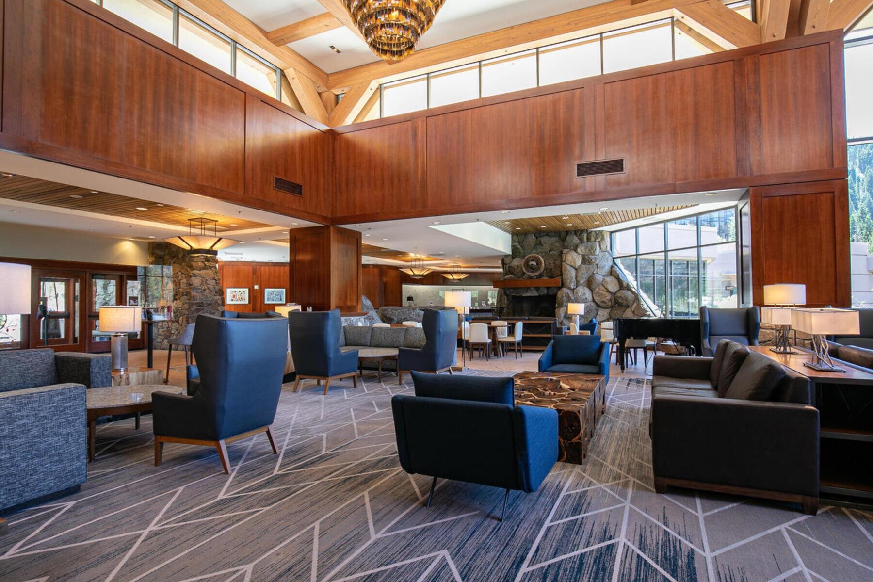 400 Resort Road, Unit 822 824 Olympic Valley, CA 96146 - Photo 22 of 28 a living room with lots of furniture and a chandelier