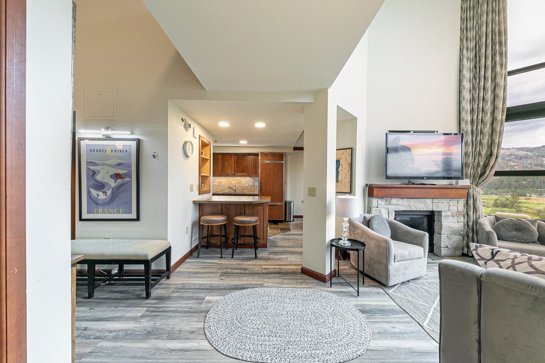 400 Resort Road, Unit 822 824 Olympic Valley, CA 96146 - Photo 7 of 28 a living room with furniture a fireplace and a large window