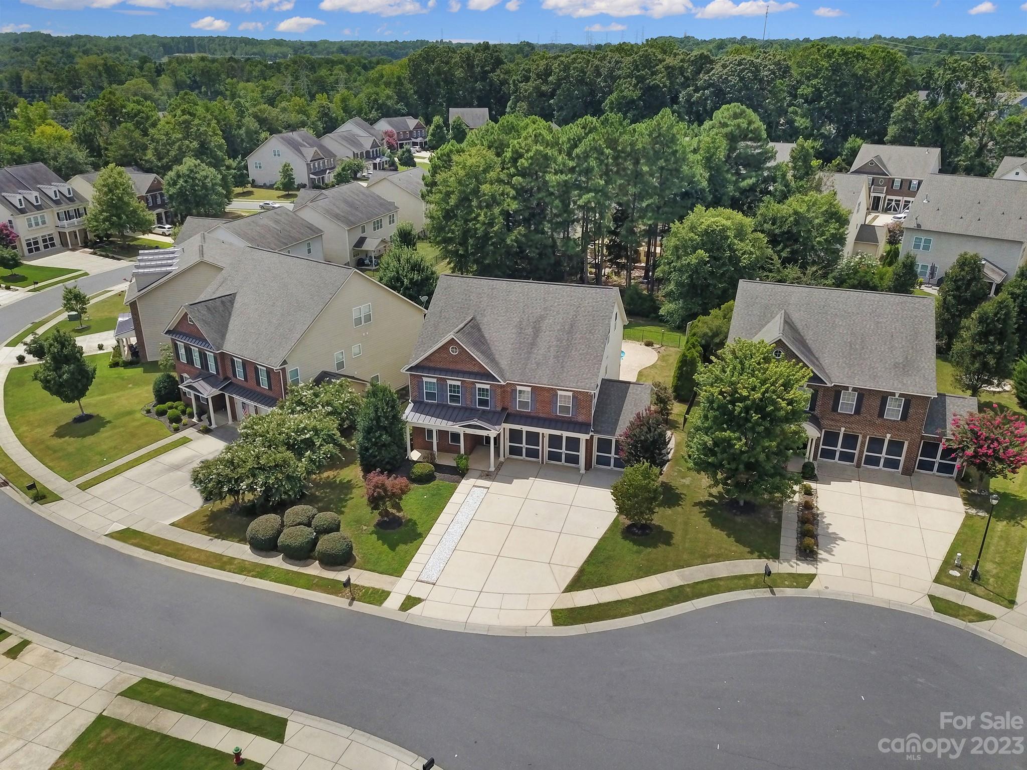 3359 Mandrake Court Tega Cay, SC 29708 - Photo 28 of 33 an aerial view of a house with swimming pool patio and mountain view
