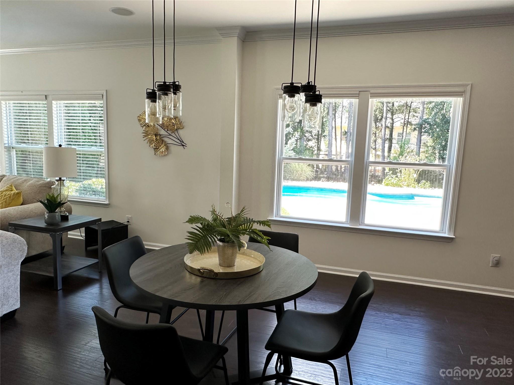 3359 Mandrake Court Tega Cay, SC 29708 - Photo 6 of 33 a view of a dining room with furniture window and wooden floor