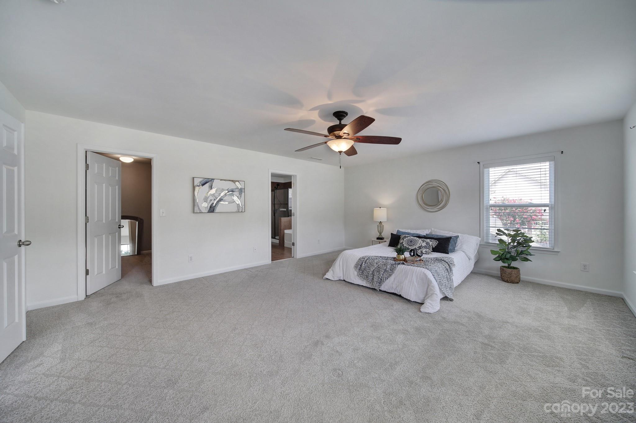3359 Mandrake Court Tega Cay, SC 29708 - Photo 8 of 33 a living room with furniture and a chandelier