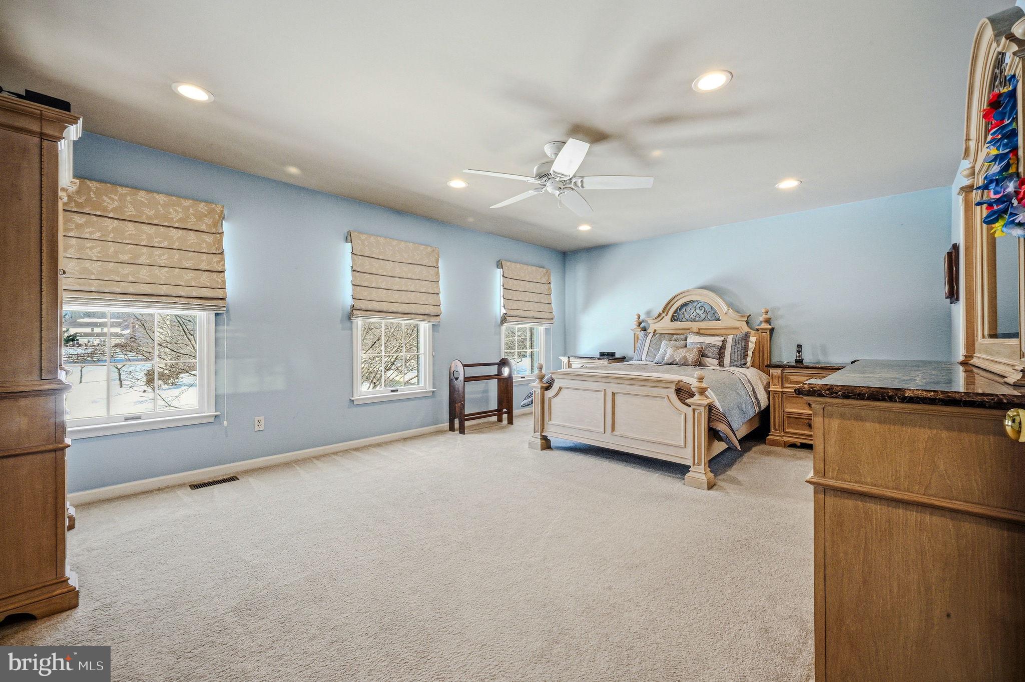 10 Auspice Circle Newark, DE 19711 - Photo 23 of 42 a spacious bedroom with a bed a dresser and potted plant