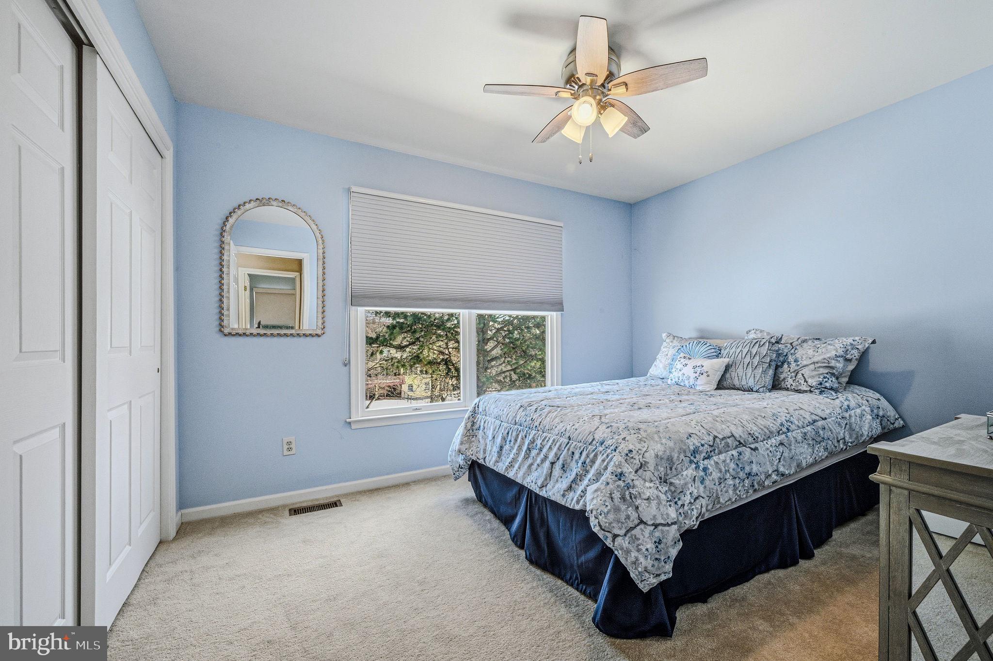 10 Auspice Circle Newark, DE 19711 - Photo 30 of 42 a spacious bedroom with a bed and a chandelier