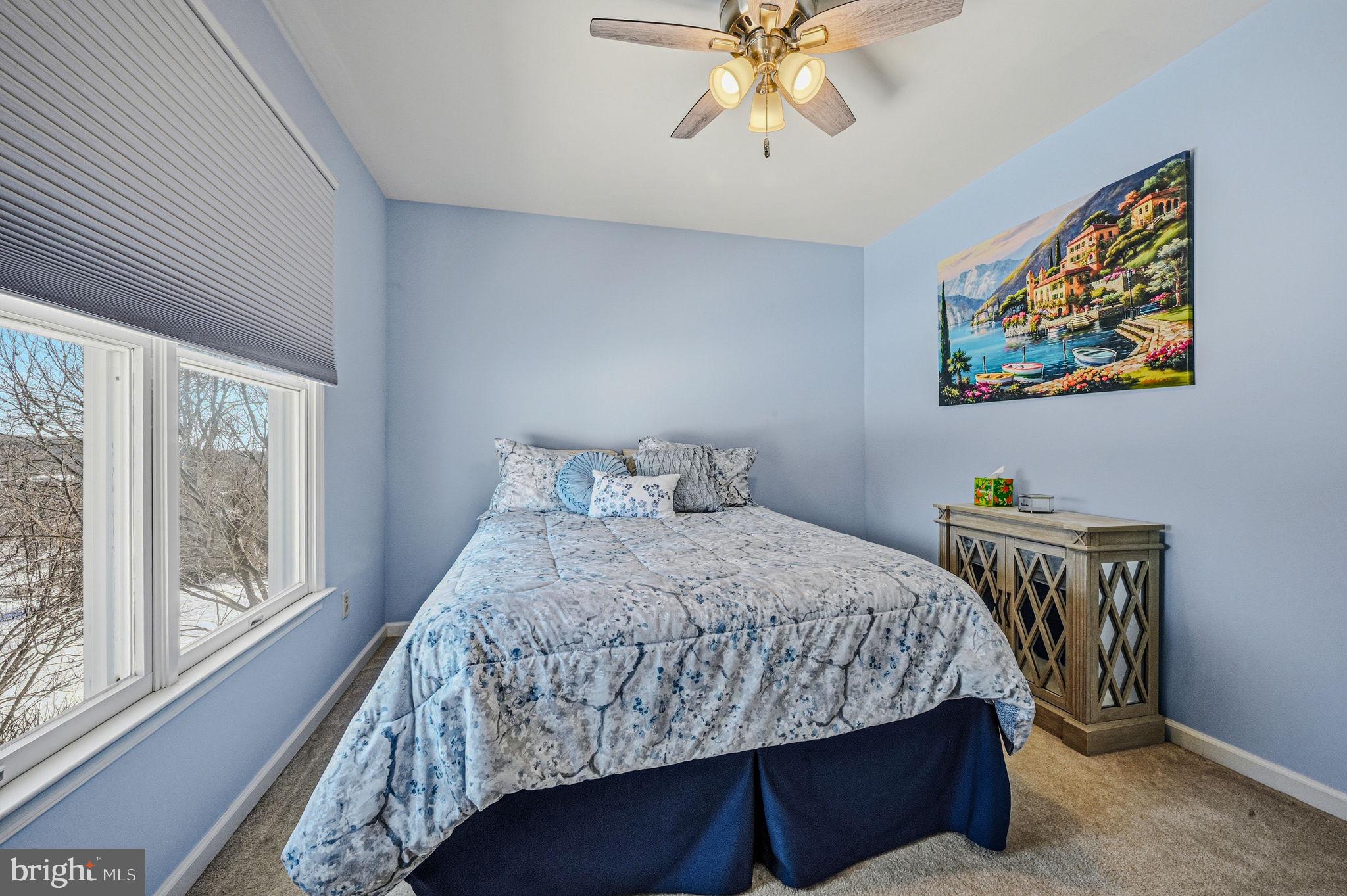 10 Auspice Circle Newark, DE 19711 - Photo 31 of 42 a bedroom with a bed and a chandelier