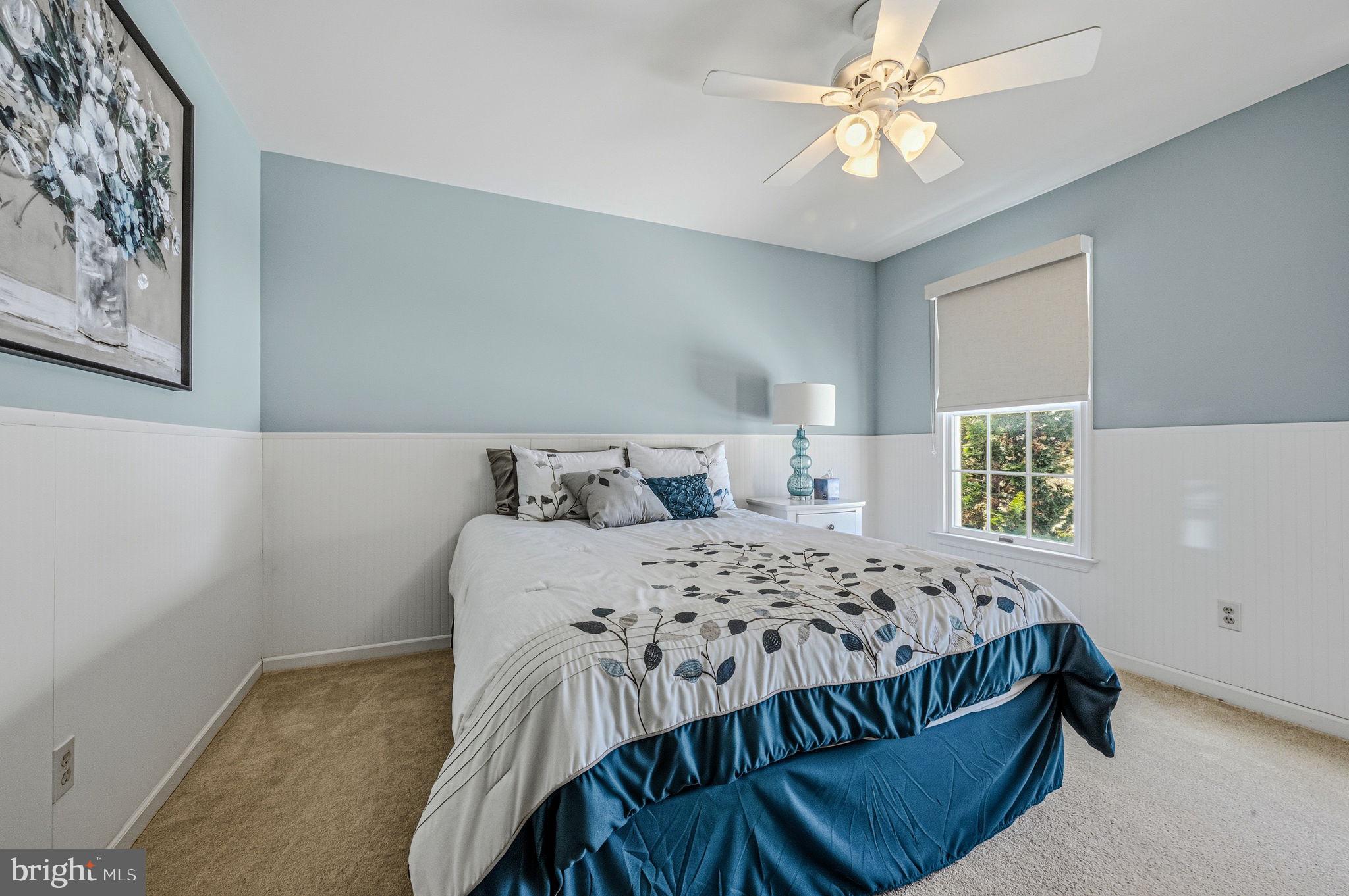 10 Auspice Circle Newark, DE 19711 - Photo 33 of 42 a bedroom with a bed and a chandelier