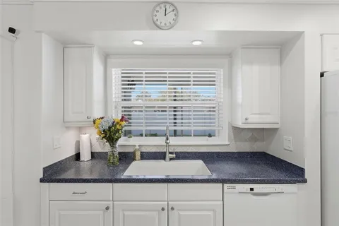 a kitchen with a sink and a window