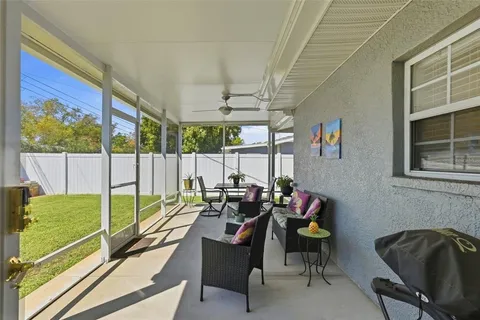 a reading room with furniture and a large window
