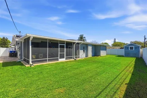 a view of a house with a garden and yard