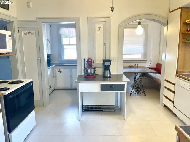 a spacious bathroom with a bathtub sink and mirror