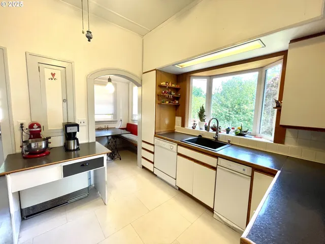 a large living room with furniture and a large window