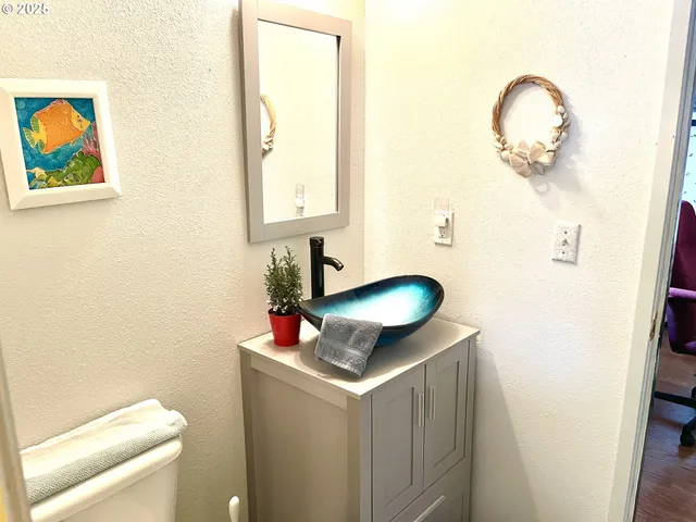 a bathroom with a toilet and a sink
