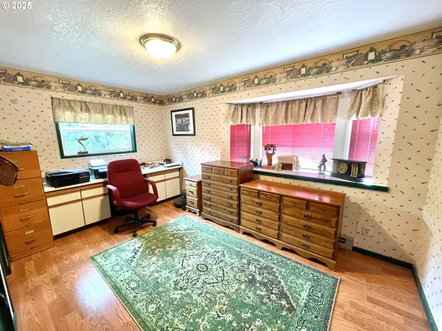 a view of living room with furniture and a rug