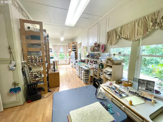 a room with lots of wooden furniture and a window