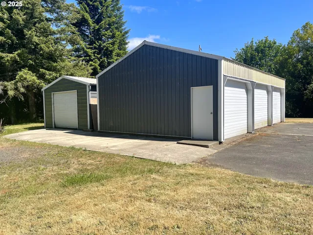 a backyard of a house with large trees