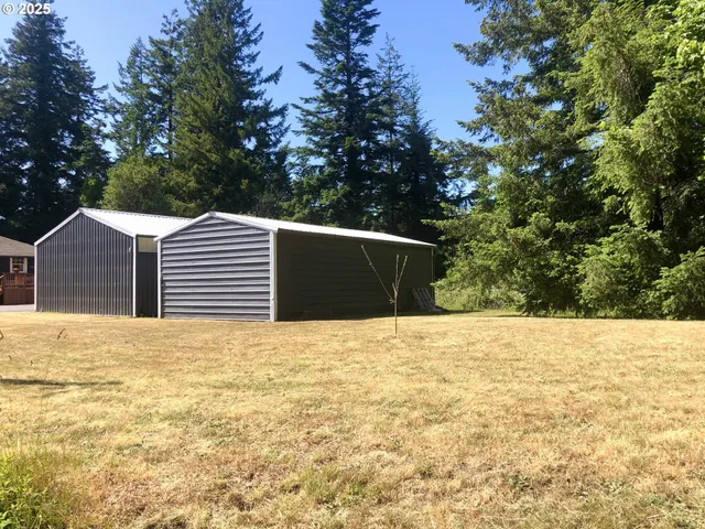 a backyard of a house with large trees