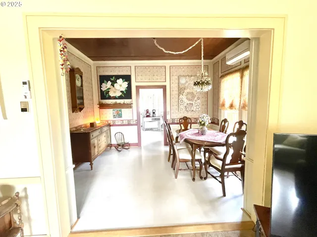 a view of a dining room with furniture window and outside view