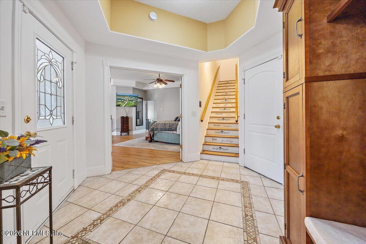 14394 Bob Burnsed Road Glen St. Mary, FL 32040 - Photo 15 of 53 a view of an entryway with wooden floor and furniture