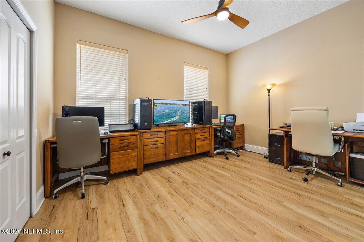 14394 Bob Burnsed Road Glen St. Mary, FL 32040 - Photo 22 of 53 a view of a workspace with furniture and a window