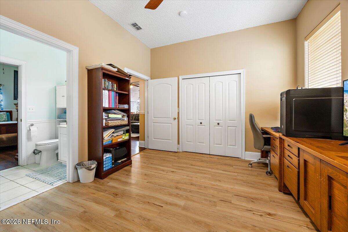14394 Bob Burnsed Road Glen St. Mary, FL 32040 - Photo 23 of 53 a view of a bedroom with furniture and wooden floor