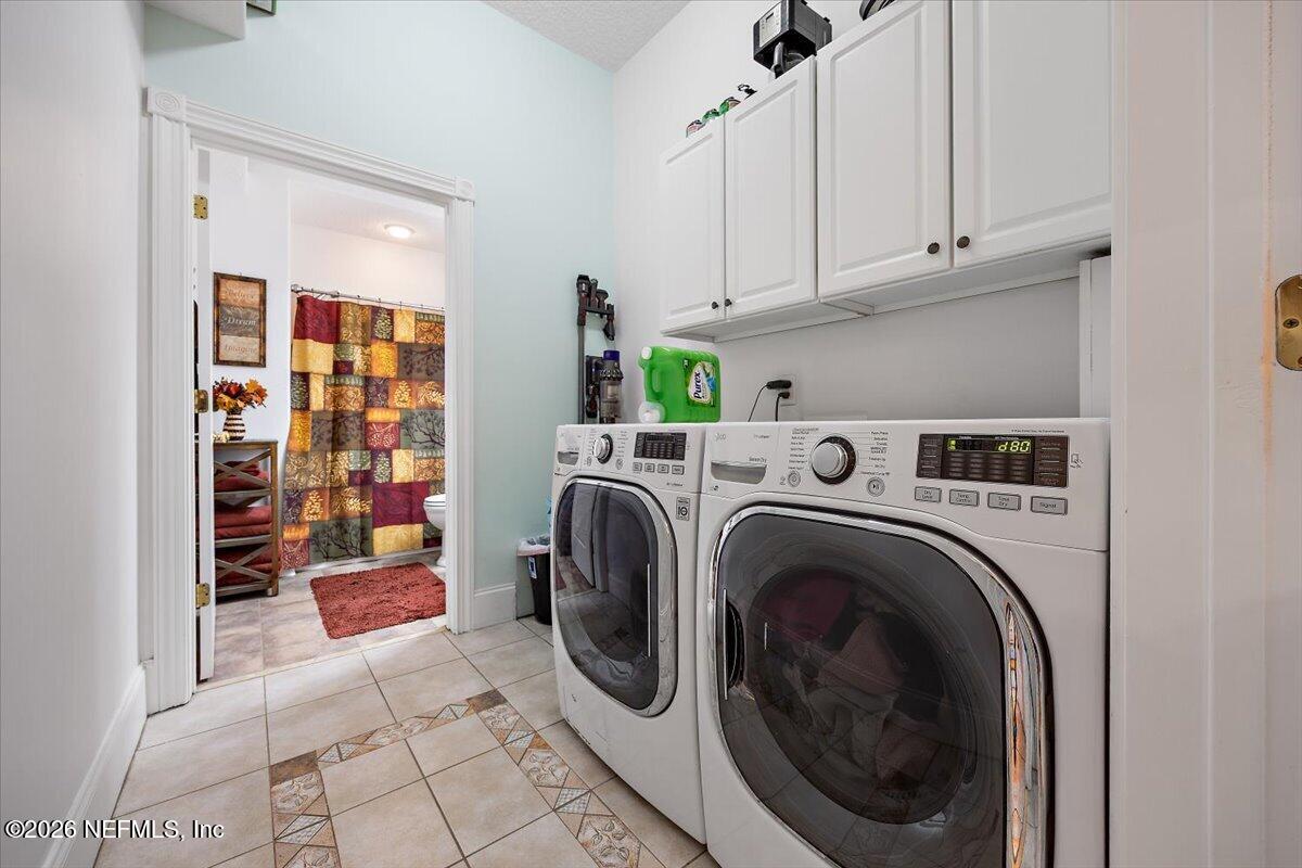 14394 Bob Burnsed Road Glen St. Mary, FL 32040 - Photo 27 of 53 a utility room with dryer and washer