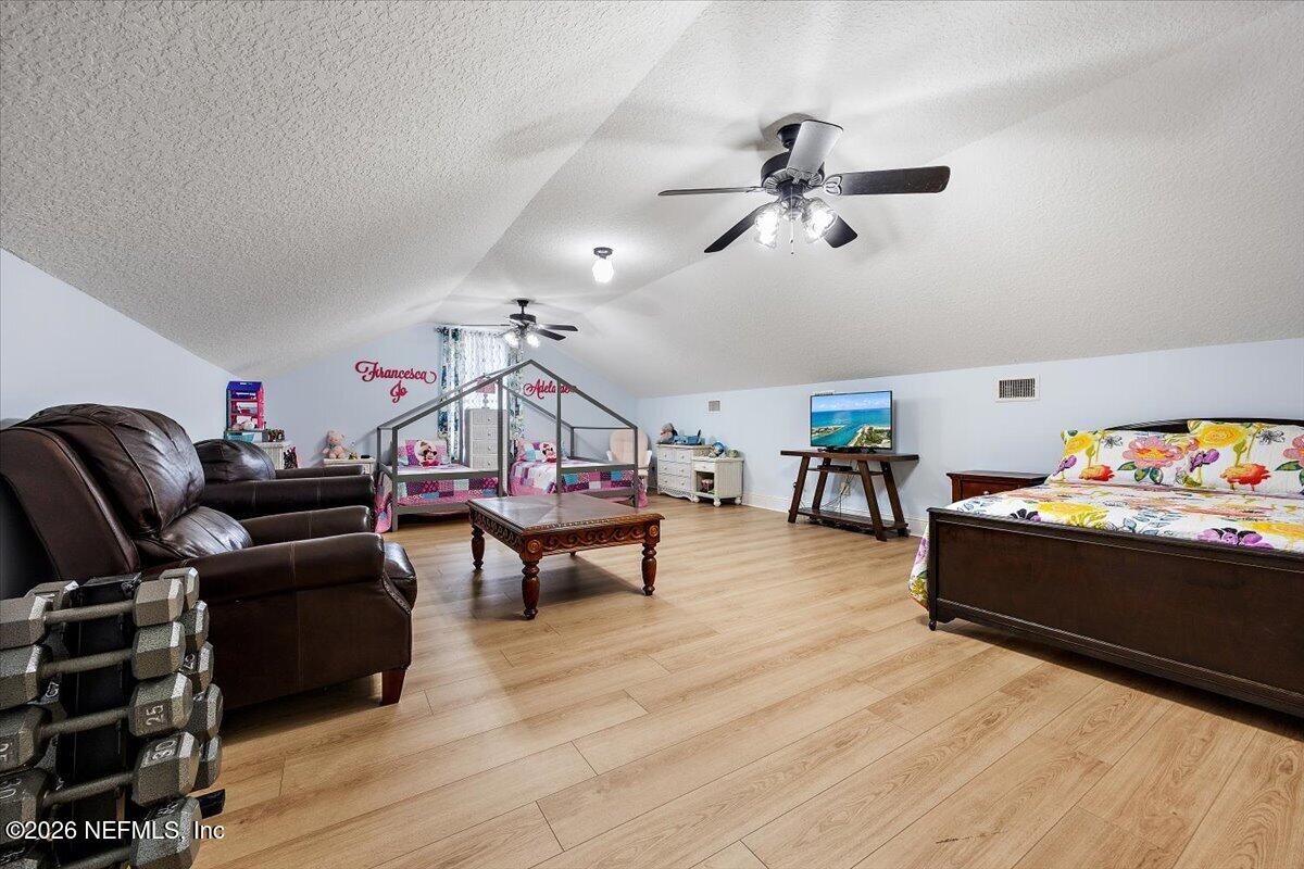 14394 Bob Burnsed Road Glen St. Mary, FL 32040 - Photo 29 of 53 a living room with furniture and a wooden floor