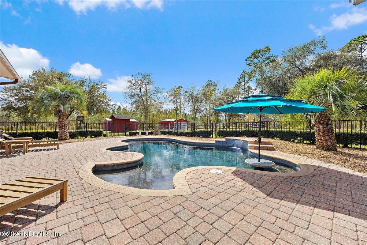 14394 Bob Burnsed Road Glen St. Mary, FL 32040 - Photo 33 of 53 a view of swimming pool with outdoor seating and plants