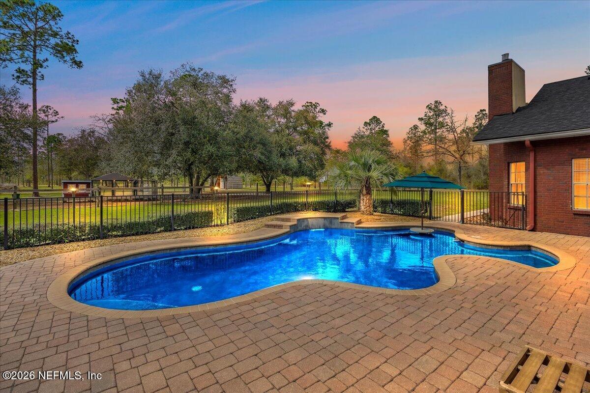 14394 Bob Burnsed Road Glen St. Mary, FL 32040 - Photo 35 of 53 a view of a house with swimming pool and sitting area
