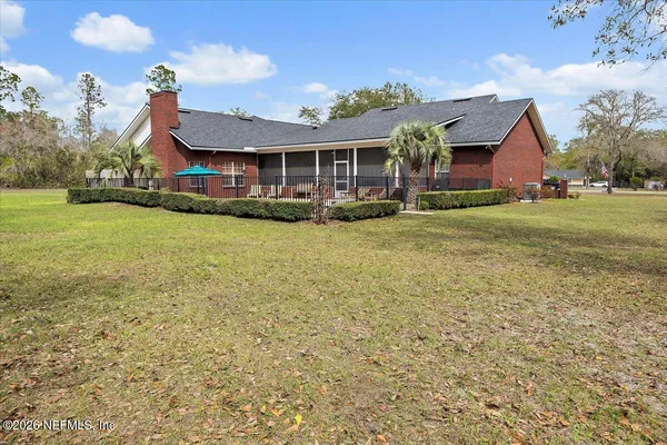 a view of a swimming pool with an outdoor space and seating area