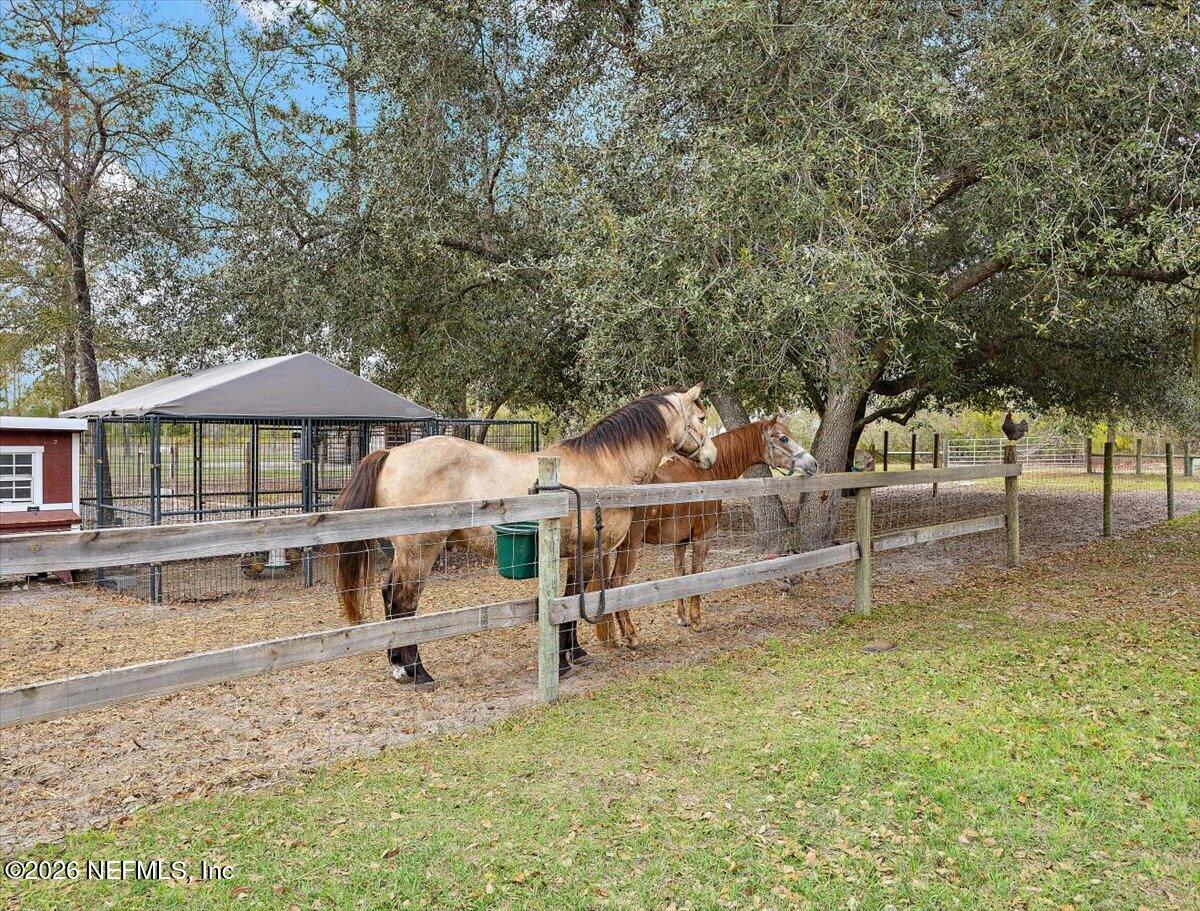 14394 Bob Burnsed Road Glen St. Mary, FL 32040 - Photo 4 of 53 a view of a house with a yard