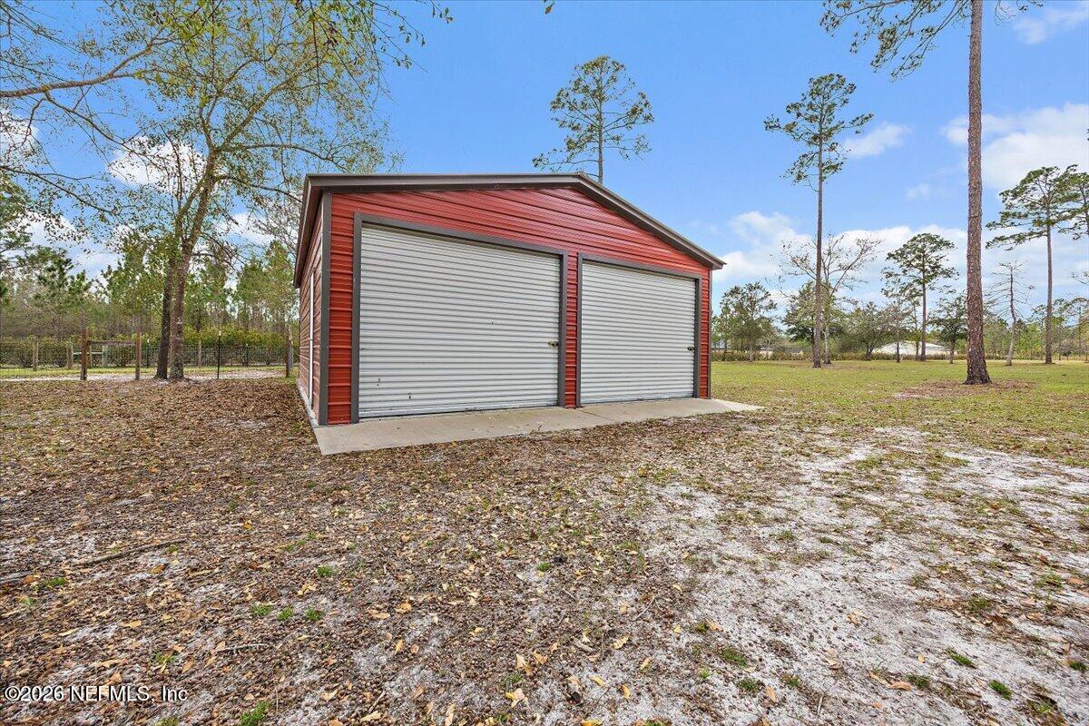 14394 Bob Burnsed Road Glen St. Mary, FL 32040 - Photo 44 of 53 a front view of a house with a yard
