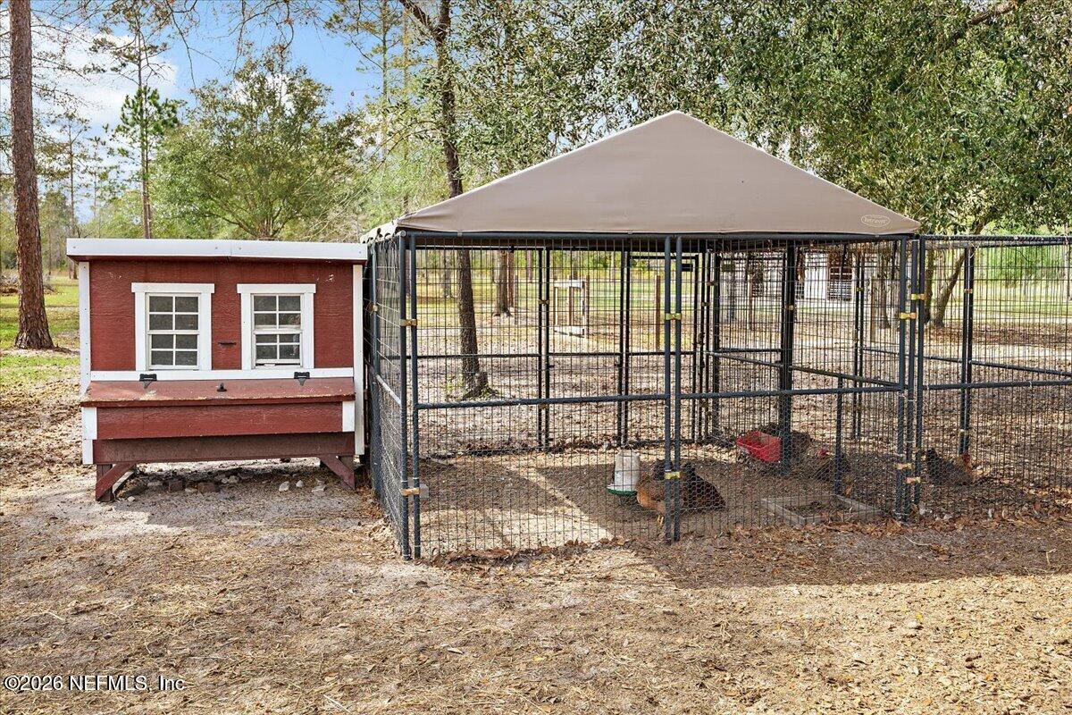14394 Bob Burnsed Road Glen St. Mary, FL 32040 - Photo 47 of 53 a view of a house with a yard and sitting area