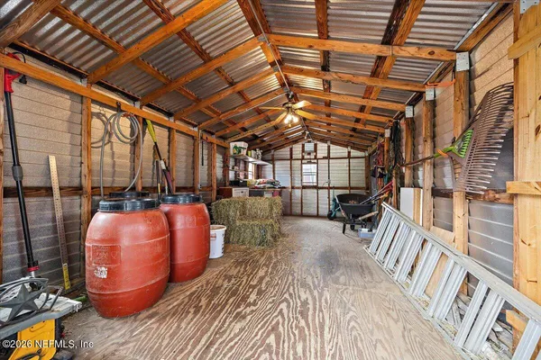 an aerial view of a house with outdoor space