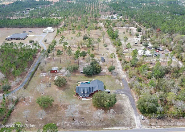 an aerial view of residential house with outdoor space