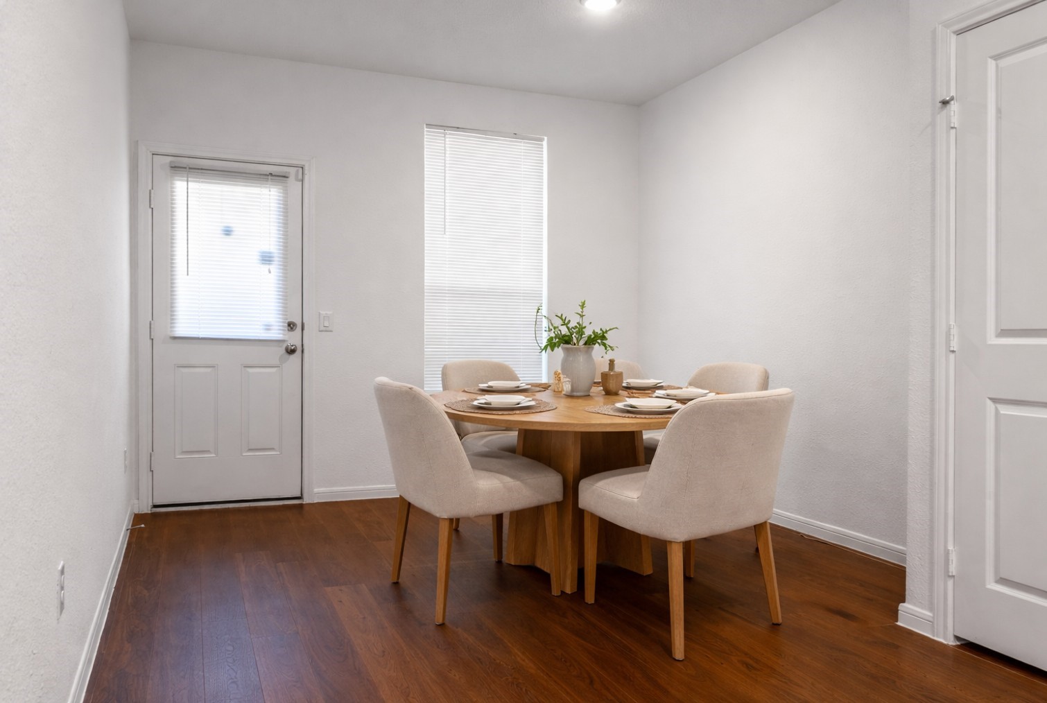 10222 Clearwick Street Houston, TX 77034 - Photo 11 of 28 a view of a dining room with furniture and wooden floor