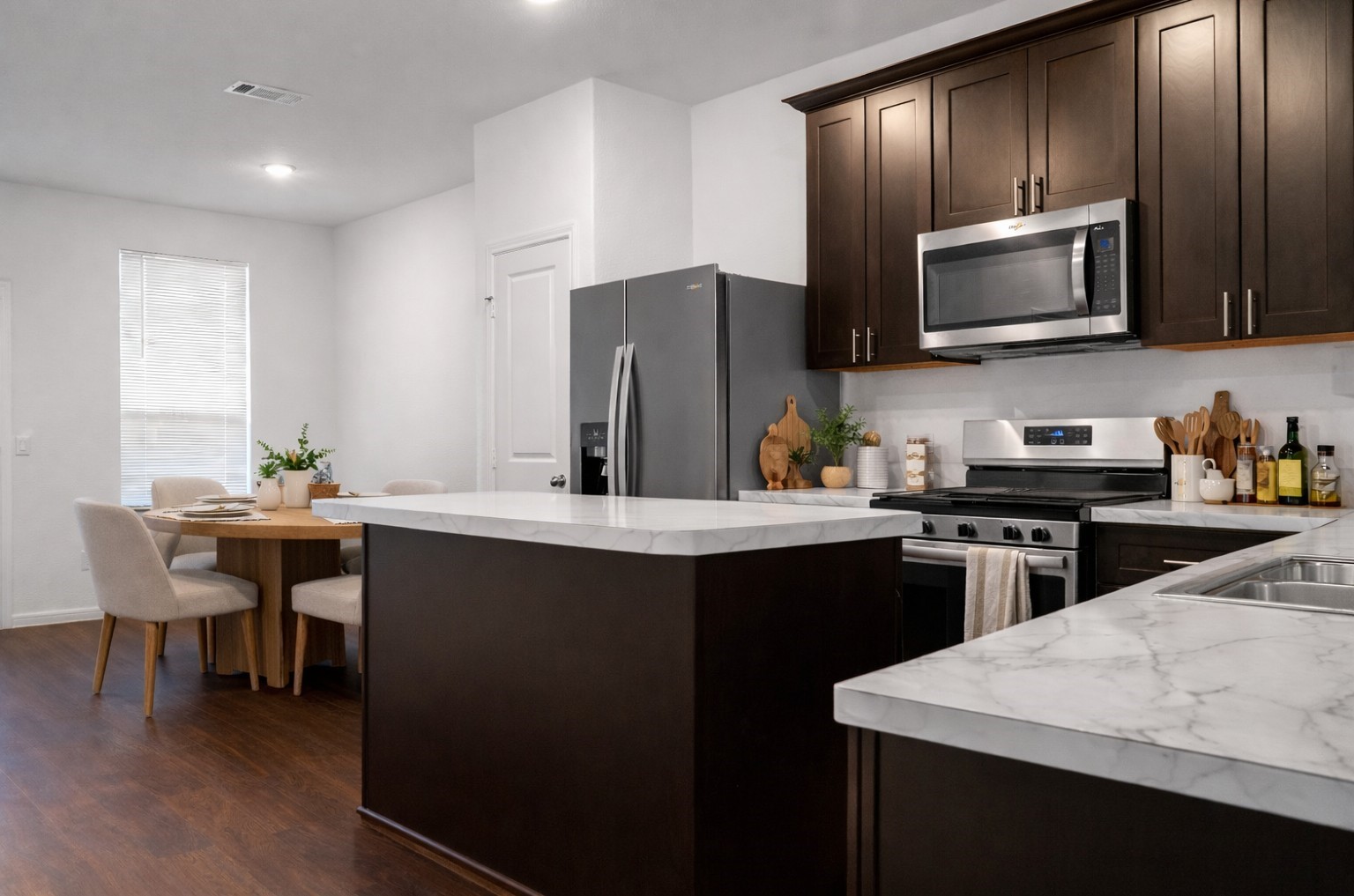 10222 Clearwick Street Houston, TX 77034 - Photo 13 of 28 a kitchen with stainless steel appliances granite countertop a sink dishwasher stove top oven and refrigerator